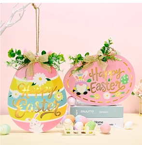 Close-up of Easter egg wooden door signs with LED lights and Happy Easter bunny designs