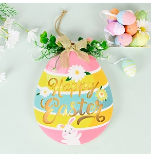 Detail of wooden Easter egg sign with Happy Easter text and bunny on green background