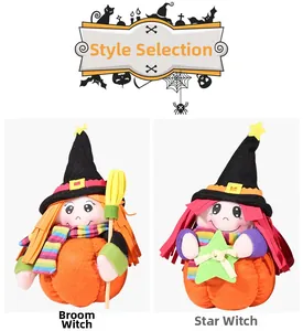 Detail of plush Halloween witch dolls with orange and red hair sitting in pumpkin bases