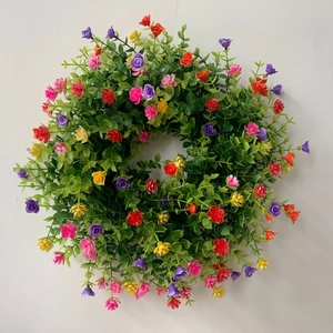 Couronne de printemps artificielle avec fleurs colorées et feuilles vertes pour décoration