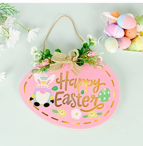 Detail of egg-shaped pink wooden Easter sign with floral bow and Happy Easter text