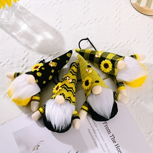 Set of four handmade bee gnome hanging ornaments with sunflower and yellow stripes