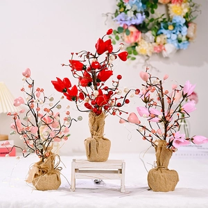 Three illuminated tulip trees with heart accents and burlap base for home decor