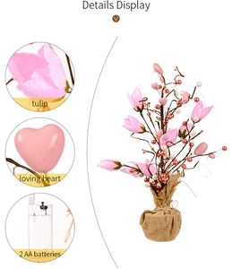 Close-up of pink tulip LED tree with burlap base, heart ornaments and battery pack