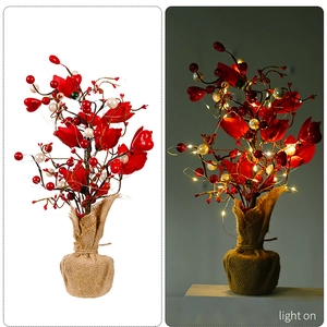 Close-up of heart tulip tree with LED lights on and off showing burlap base details