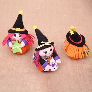 Three Halloween plush witch dolls with pumpkin bases and striped scarves for holiday decor
