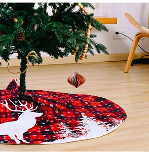 Detail of red and black buffalo plaid Christmas tree skirt with reindeer pattern