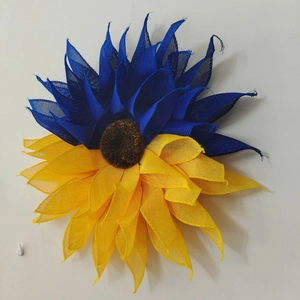 Close-up of Ukraine flag sunflower wreath with blue and yellow mesh petals
