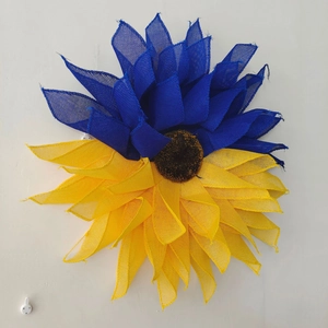 Close-up of handmade blue and yellow sunflower deco mesh wreath decoration