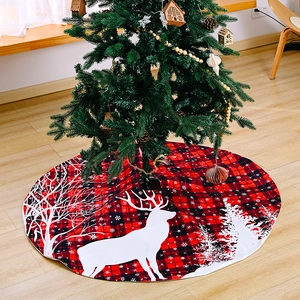 Red and black plaid Christmas tree skirt with white reindeer and snowflake patterns