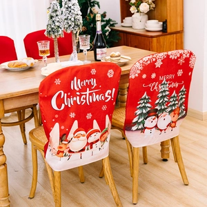 Red Christmas chair covers with Santa and reindeer motifs for festive dining decor