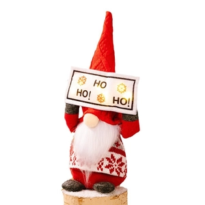 Lighted Christmas gnome plush with HO HO HO sign on a rustic wooden base decoration