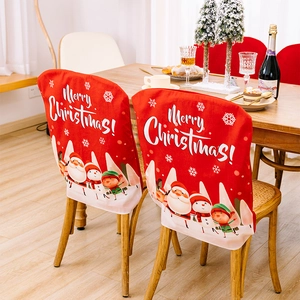 Red Christmas chair cover with Santa Claus and reindeer print for festive dining room decor