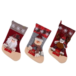 Three-piece Christmas stocking set featuring Santa, snowman, and reindeer figures on white