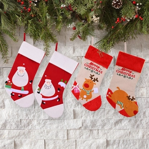 Set of 4 festive Christmas stockings featuring Santa and reindeer with hanging loops