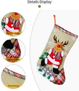 Detail view of large burlap Christmas stocking with 3D reindeer applique and plaid hem