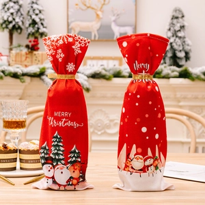 Christmas wine bottle gift bags with Santa and reindeer prints and gold ribbon ties