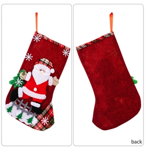 Front and back view of large burlap Christmas stockings with Santa and plaid cuff