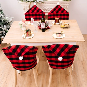 Christmas chair covers with red black plaid pattern and white pom poms for home decor