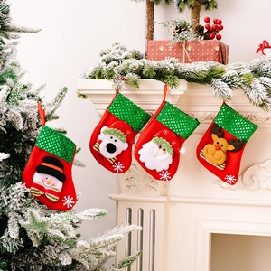 Set of 4 Christmas stockings with sequins, snowman and Santa for holiday fireplace decor