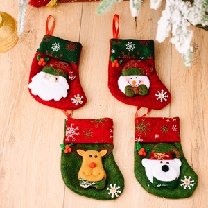 Set of 4 Christmas stockings featuring Santa, Snowman, Reindeer, and Polar Bear dolls