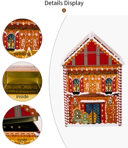 Close-up of gingerbread house tin box featuring festive prints and golden metal interior