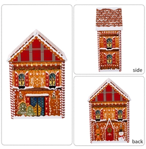 Three-view detail of house-shaped Christmas gingerbread tin box with festive prints