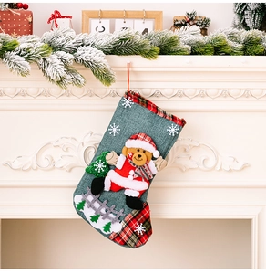 Linen Christmas stocking with 3D Santa and bear embroidery on white fireplace mantle