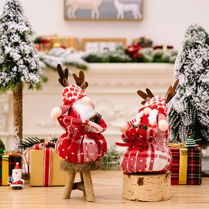 Christmas gnome couple with reindeer antlers and red plaid hats for holiday home decoration