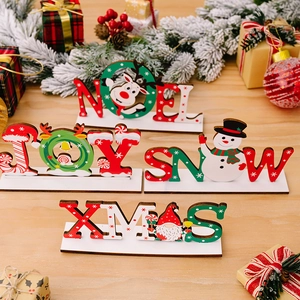 Set of 4 Christmas wooden desk ornaments featuring Noel, Joy, Snow, and Xmas printed signs