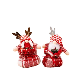 Christmas reindeer gnome gift bags with red plaid hats and festive holiday decorations