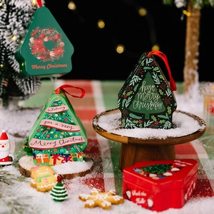 Christmas tin gift boxes in house and tree shapes with festive illustrations and red ribbons