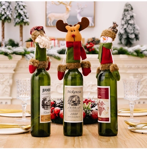 Three-piece Christmas wine bottle covers featuring Santa, reindeer, and snowman designs