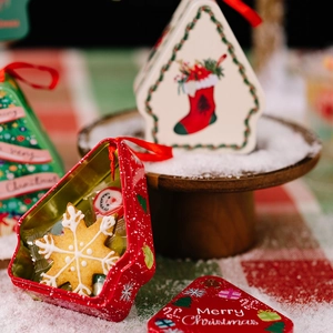 Christmas cottage tin box with red lid and festive prints for holiday gift packaging