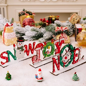 Three-piece Christmas wooden desk signs featuring SNOW, JOY, and NOEL with holiday motifs