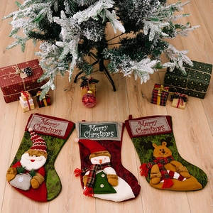 Three-piece Christmas stocking set with Santa, Snowman, and Reindeer 3D designs