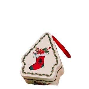 Polygonal Christmas tin gift box with festive floral print and red carrying handle