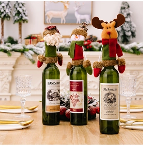 Christmas wine bottle covers featuring Santa, snowman and reindeer with scarf details