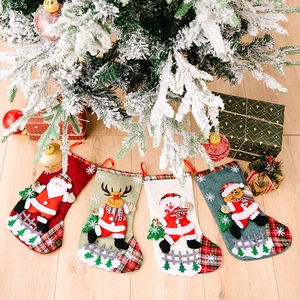 Set of 4 burlap Christmas stockings with 3D Santa Elk Snowman and Bear on wood surface