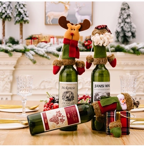 Detailed view of Christmas wine bottle covers featuring Santa, elk, and snowman designs