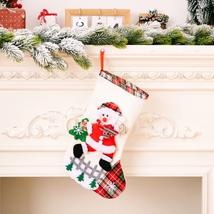 Linen Christmas stocking with snowman doll and red plaid cuff for festive tree decor