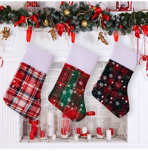 Three-piece plaid Christmas stocking set with white faux fur trim and snowflake pattern