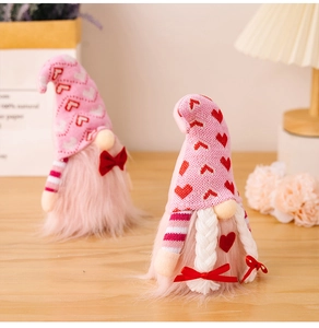 Detailed close-up of handmade Valentine's Gnomes with pink knit hats and heart patterns