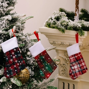 Mini plaid Christmas stocking cutlery holders with snowflake patterns for holiday decor