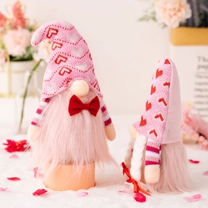 Pink and red plush Valentines Day gnomes set with hearts and knitted hats for romantic decor