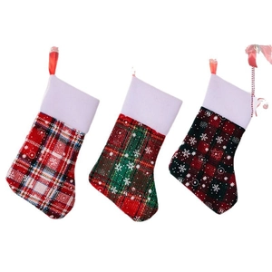 Plaid Christmas stocking cutlery holder set with white snowflake patterns for holiday decor