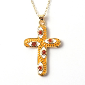 Minimalist gold-plated cross necklace with orange enamel and red zircon evil eye detail