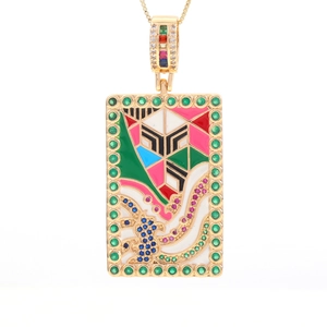 Macro shot of rectangular gold necklace with multi-color enamel and micro-inlaid gemstones