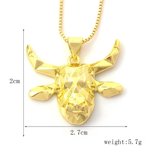 Macro shot of gold bull head pendant with geometric facets and chain dimensions