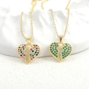 Macro view of broken heart necklaces with colorful cubic zirconia in gold plating